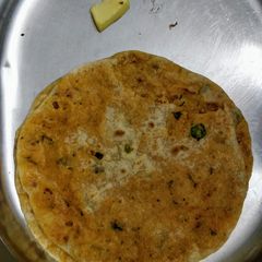 A picture of Spicy Holige with left over upma/rice items.