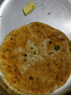 A picture of Spicy Holige with left over upma/rice items.