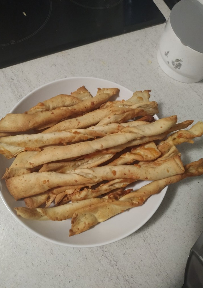 Una foto de Palitos de pan con queso