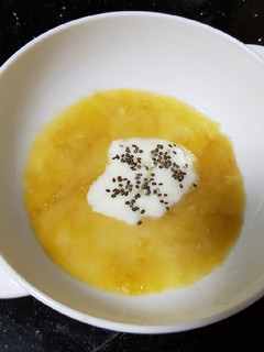A picture of Banana yogurt with chia seeds for baby.