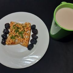 A picture of Beans on scrambled egg on toast.