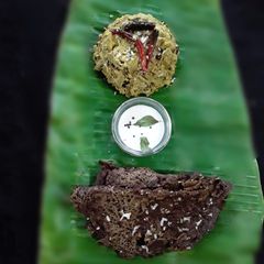 A picture of Chakka kuzhachathu raw jackfruit curry with millet pitha.