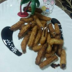 A picture of Eggless churros with chocolate sauce.