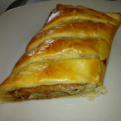 A picture of Parma ham and smoked cheese roll up pie.