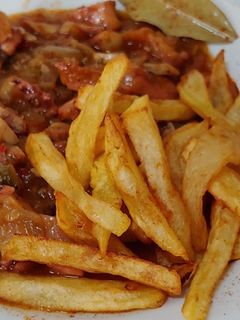 Una foto de Pulpo encebollado con patatas