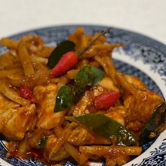A picture of Stir-fry chicken red curry and bamboo shoot.