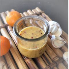 A picture of Tangerine Garlic Mustard Salad dressing.