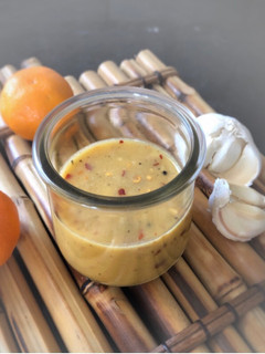 A picture of Tangerine Garlic Mustard Salad dressing.