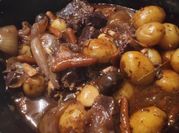 A picture of beef chuck roast in dutch oven