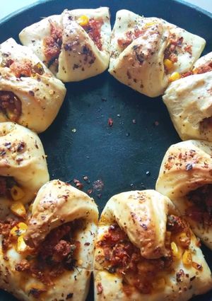 A picture of Paneer Bhurji Desi Pizza bite.