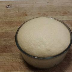 A picture of Thin crust pizza dough.