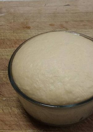 A picture of Thin crust pizza dough.