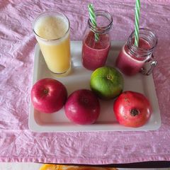 A picture of Pomegranate apple/ and mosambi/orange juice / refreshing healthy.