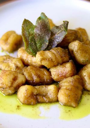 A picture of Potato and parsnip gnocchi with green pesto and crispy sage 🌿.