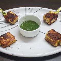 A picture of Paneer tikka popsicles.
