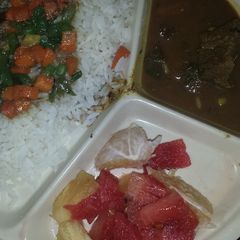 White rice and vegetable sauce A picture of White rice and vegetable sauce.
