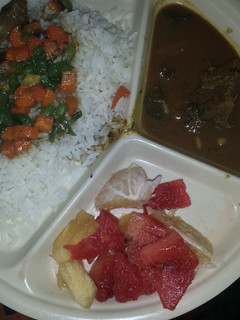 A picture of White rice and vegetable sauce.