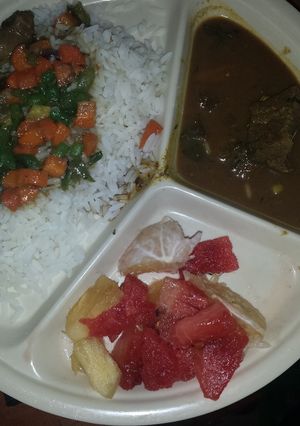 A picture of White rice and vegetable sauce.