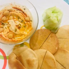 A picture of Hummus With Toasted Pita Bread.