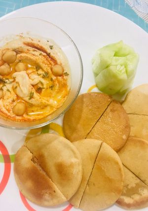 A picture of Hummus With Toasted Pita Bread.