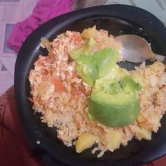 A picture of Fried rice with irish potatoes and scrambled eggs.