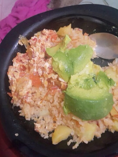 A picture of Fried rice with irish potatoes and scrambled eggs.
