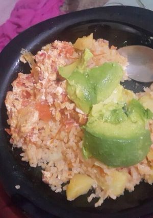 A picture of Fried rice with irish potatoes and scrambled eggs.