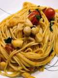 Linguine with bay scallops, bacon, and tomatoes