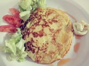 Una foto de arepa de choclo
