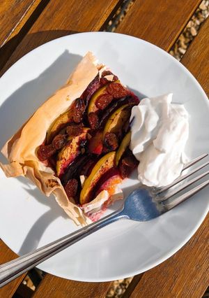 A picture of Apple and plum filo tart.