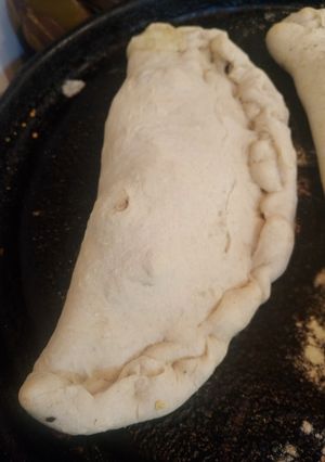 Una foto de Calzone de hongos,manzana y mozzarella