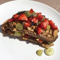 A picture of Breakfast amazingness😋 French toast with cereals and fresh fruits🍓🍇.