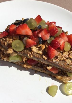 A picture of Breakfast amazingness😋 French toast with cereals and fresh fruits🍓🍇.