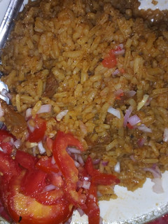 A picture of Beef pilau and kachumbari.