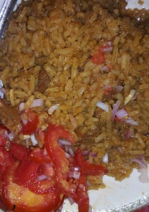 A picture of Beef pilau and kachumbari.