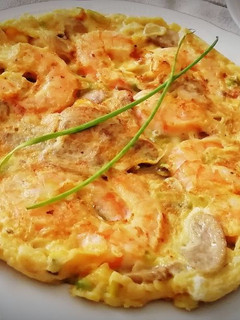 Una foto de Tortilla de Champiñones con Langostinos