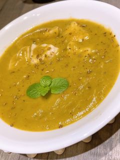 A picture of Coconut Milk Pumpkin Soup with Dumplings.