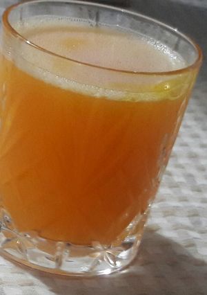 Una foto de Jugo de mandarina y granadilla