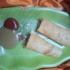 A picture of Moong Daal And Rice cheela with stuffed veggies.