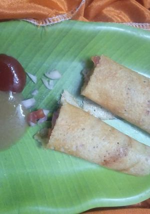 A picture of Moong Daal And Rice cheela with stuffed veggies.