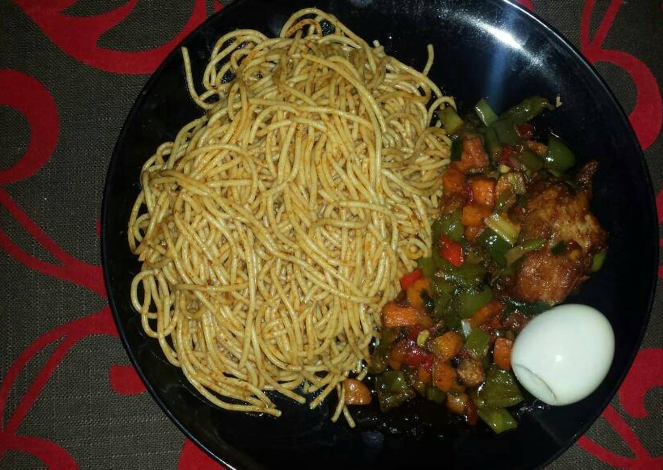 Jollof spaghetti and vegetable sauce with turkey