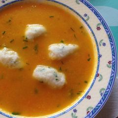 A picture of Carrot Soup with Grießklöchen (Semolina Dumplings).