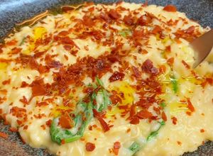 Foto de Risoto de queijo brie com presunto crocante e rúcula