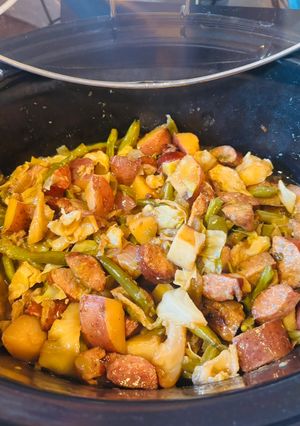 A picture of Slow Cooker Cajun Sausage and Potatoes (serve over rice).