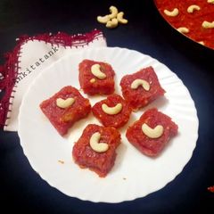 A picture of Gajar Ka Halwa with milk and cashews.