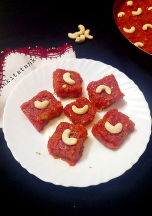 A picture of Gajar Ka Halwa with milk and cashews.