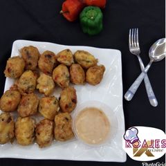 A picture of Yam balls with deeping sauce.