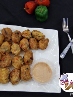 A picture of Yam balls with deeping sauce.