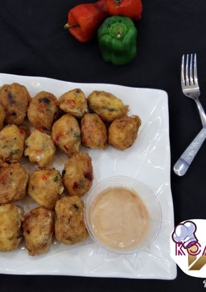 A picture of Yam balls with deeping sauce.