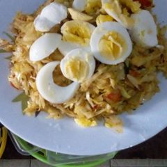 A picture of Fried Cabbage with boiled eggs.